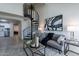 Open-concept living room boasts a spiral staircase and flows into the kitchen and bedroom at 4901 S Calle Los Cerros Dr # 237, Tempe, AZ 85282