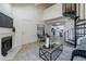 Spacious living room with spiral staircase, fireplace, and open access to the kitchen at 4901 S Calle Los Cerros Dr # 237, Tempe, AZ 85282