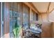 Inviting outdoor patio with table, chairs, a plant, and views framed by stylish, multi-paned windows at 4901 S Calle Los Cerros Dr # 237, Tempe, AZ 85282