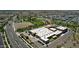 A captivating aerial view showcases a community with a school, park, and well-planned residential layout at 5223 S Axiom --, Mesa, AZ 85212
