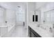 Spacious bathroom with dual sinks, tiled floors, and a view of the soaking tub at 5223 S Axiom --, Mesa, AZ 85212