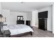 Bedroom featuring a king bed, a chest of drawers, and light hardwood style floors, perfect for relaxation at 5223 S Axiom --, Mesa, AZ 85212