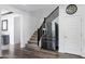 Bright entryway with staircase, stainless steel refrigerator, and wood-style flooring at 5223 S Axiom --, Mesa, AZ 85212