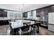 Elegant kitchen with large island, dark cabinetry, and pendant lighting at 5223 S Axiom --, Mesa, AZ 85212