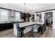 Modern kitchen featuring an island with seating, pendant lights, and stylish backsplash at 5223 S Axiom --, Mesa, AZ 85212