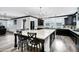 Bright kitchen with a large island, dark cabinets, and stainless steel appliances at 5223 S Axiom --, Mesa, AZ 85212