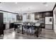 Spacious kitchen with a large island, dark cabinetry, and modern chandeliers at 5223 S Axiom --, Mesa, AZ 85212