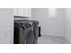 Laundry room with modern Samsung washer and dryer and ample cabinet space at 5223 S Axiom --, Mesa, AZ 85212