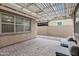 Cozy outdoor patio area, features two chairs, and a lovely pergola for shaded relaxation and enjoyment at 5223 S Axiom --, Mesa, AZ 85212