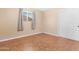 Bedroom with tile floors and window at 612 N Recker Rd, Mesa, AZ 85205