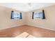 A serene bedroom with two windows providing ample natural light at 612 N Recker Rd, Mesa, AZ 85205