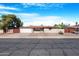 Charming single-story home with a well-maintained front yard and attached two-car garage at 612 N Recker Rd, Mesa, AZ 85205
