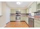 A kitchen with stainless steel appliances, tile backsplash and stone countertops at 612 N Recker Rd, Mesa, AZ 85205