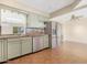 An open kitchen featuring granite countertops, stainless steel appliances, and tile floors at 612 N Recker Rd, Mesa, AZ 85205
