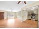 A spacious living room featuring tile floors, and a dining room at 612 N Recker Rd, Mesa, AZ 85205