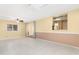 Spacious living room with tile flooring, skylight, and modern lighting at 612 N Recker Rd, Mesa, AZ 85205