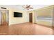 An empty living room with tile floors, and a large window at 612 N Recker Rd, Mesa, AZ 85205