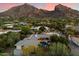 Stunning aerial view of a modern home with a pool and mountain views at 6417 N 52Nd Pl, Paradise Valley, AZ 85253