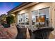 Inviting back deck with comfortable wicker furniture offering stunning views of the home's interior at 6417 N 52Nd Pl, Paradise Valley, AZ 85253