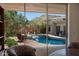 Inviting backyard pool with mountain views, wooden deck, and unique decor, perfect for relaxation at 6417 N 52Nd Pl, Paradise Valley, AZ 85253