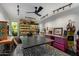 Bright craft room with ample storage, track lighting, and views of the exterior landscape at 6417 N 52Nd Pl, Paradise Valley, AZ 85253