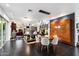 Bright dining area featuring a modern chandelier and a unique wooden accent wall at 6417 N 52Nd Pl, Paradise Valley, AZ 85253