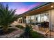 An inviting outdoor entertainment space is enhanced by palm trees, lush landscaping, and seamless access to the main bedroom at 6417 N 52Nd Pl, Paradise Valley, AZ 85253