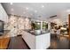 Bright and airy kitchen showcasing a large island and a view of the outdoor living space at 6417 N 52Nd Pl, Paradise Valley, AZ 85253