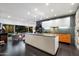 Modern kitchen featuring a large island, sleek cabinetry, and sliding glass doors to the outdoor pool area at 6417 N 52Nd Pl, Paradise Valley, AZ 85253