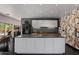 Modern kitchen featuring sleek countertops, stylish cabinetry, and a view to the outdoor pool area at 6417 N 52Nd Pl, Paradise Valley, AZ 85253