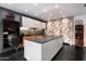 Spacious kitchen features stainless steel appliances, dark countertops, and modern cabinetry at 6417 N 52Nd Pl, Paradise Valley, AZ 85253