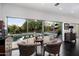 Relaxing living room with views of the inviting backyard pool and deck at 6417 N 52Nd Pl, Paradise Valley, AZ 85253