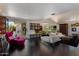 Stunning open living room featuring sleek black tile, modern fireplace, and bright, airy layout at 6417 N 52Nd Pl, Paradise Valley, AZ 85253
