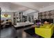Bright, modern living area with a fireplace, built-in shelving, and open concept design at 6417 N 52Nd Pl, Paradise Valley, AZ 85253