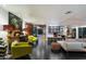 Spacious living room with modern furniture, fireplace, and seamless indoor-outdoor flow to the pool at 6417 N 52Nd Pl, Paradise Valley, AZ 85253