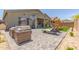 Well maintained backyard featuring outdoor seating, a playground, and desert landscaping at 6422 W Brookhart Way, Phoenix, AZ 85083