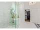 Luxurious bathroom featuring a glass-enclosed shower, soaking tub, and walk-in closet for ultimate relaxation at 6422 W Brookhart Way, Phoenix, AZ 85083