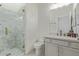 Bathroom featuring a glass-enclosed shower, tiled walls, and a vanity at 6422 W Brookhart Way, Phoenix, AZ 85083