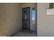 Inviting front entrance with a decorative wreath and a secure screen door at 6422 W Brookhart Way, Phoenix, AZ 85083