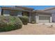 Landscaped front yard showcasing desert landscaping and a charming home exterior at 6422 W Brookhart Way, Phoenix, AZ 85083