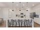 Bright kitchen featuring a center island with bar seating, sleek countertops, and stainless appliances at 6422 W Brookhart Way, Phoenix, AZ 85083