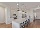 Modern kitchen with white cabinetry, a quartz countertop island, and stainless-steel appliances at 6422 W Brookhart Way, Phoenix, AZ 85083