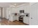 Modern kitchen features stainless steel appliances and white cabinetry providing a sleek and stylish cooking space at 6422 W Brookhart Way, Phoenix, AZ 85083