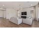Spacious living room with hardwood floors, contemporary lighting and large window at 6422 W Brookhart Way, Phoenix, AZ 85083