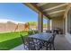Covered patio with an outdoor dining set, barbecue, and a view of the backyard at 6422 W Brookhart Way, Phoenix, AZ 85083