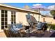 Outdoor living space featuring comfortable seating, stylish decor, and a dining area, perfect for entertaining at 6901 E Portland St, Scottsdale, AZ 85257