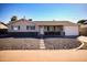 Charming single-story home with a well-maintained front yard, stone accents, and a welcoming entrance at 6901 E Portland St, Scottsdale, AZ 85257
