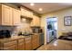 Lovely kitchen with stone countertops, stainless steel appliances, and wood cabinets at 6901 E Portland St, Scottsdale, AZ 85257