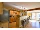Kitchen featuring bar seating and stainless steel appliances at 6901 E Portland St, Scottsdale, AZ 85257