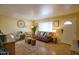 Cozy living room with warm colors, comfortable seating, and lots of natural light at 6901 E Portland St, Scottsdale, AZ 85257